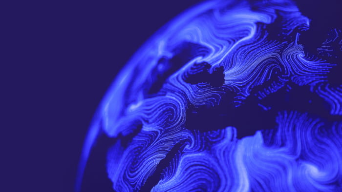 Une illustration abstraite d’une Terre bleue recouverte de lignes bleu clair représentant les routes maritimes. Il se trouve sur un fond indigo foncé. 